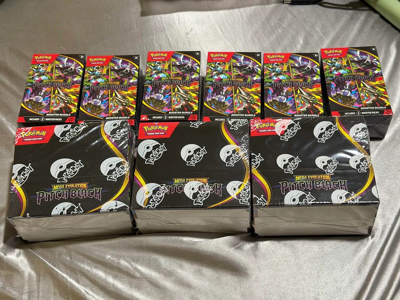 A member’s nine sealed Pitch Black products after HOC Slots fulfillment